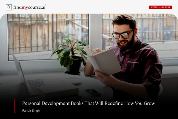 A person reading a book on desk highlighting best personal development books — Findmycourse.ai